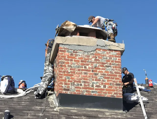 Canton Chimney Sweep installing a custom chimney crown in Canton, CT