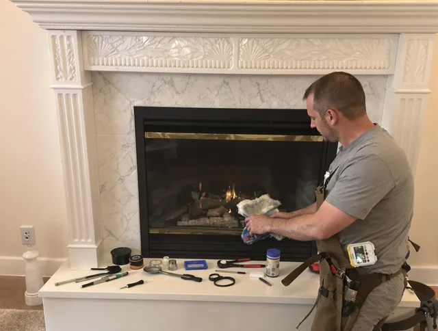 Canton Chimney Sweep performing fireplace maintenance in Canton, CT