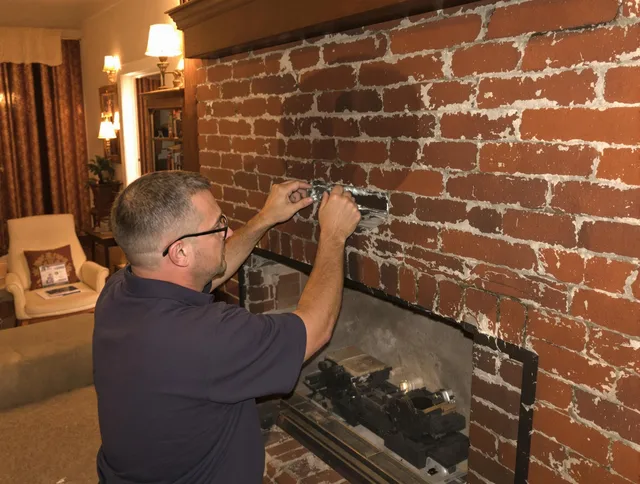 Canton Chimney Sweep expert fixing a fireplace in Canton, CT